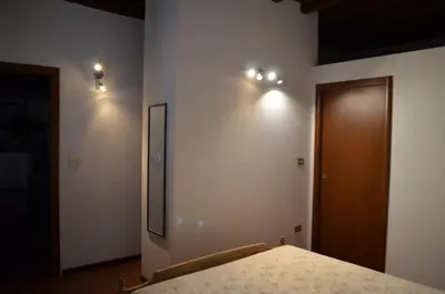Letto o letti in una camera di Agriturismo Cipolli e Podò Corte Carlini