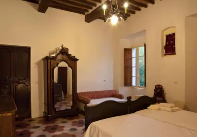 Letto o letti in una camera di Podere Pradarolo