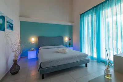 Letto o letti in una camera di Anima Mundi