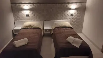 Letto o letti in una camera di Hotel La Torre