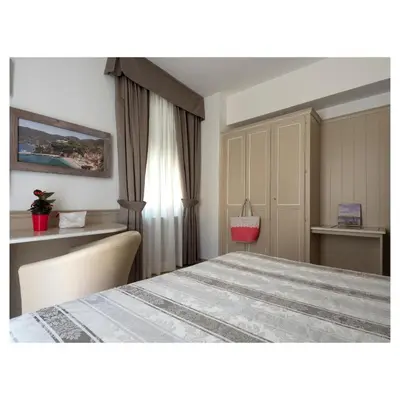 Letto o letti in una camera di Hotel Margherita