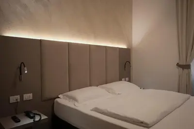 Letto o letti in una camera di Hotel Margherita
