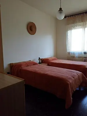 Letto o letti in una camera di Via della Chiusa 101