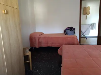 Letto o letti in una camera di Via della Chiusa 101