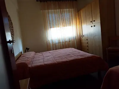 Letto o letti in una camera di Via della Chiusa 101