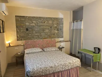 Letto o letti in una camera di UvaMatta