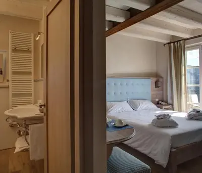 Letto o letti in una camera di Agriturismo Costa di Faraggiana