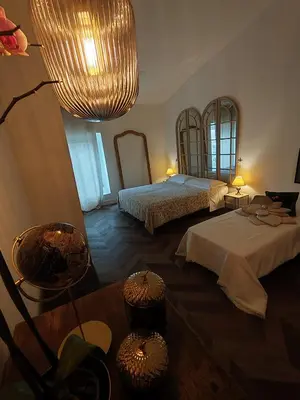 Letto o letti in una camera di Garda Relais Antica Romelia