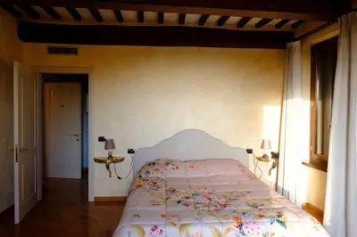 Letto o letti in una camera di Agriturismo Corte Palazzo