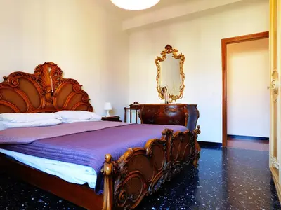Letto o letti in una camera di Le stanze del papa, Levanto