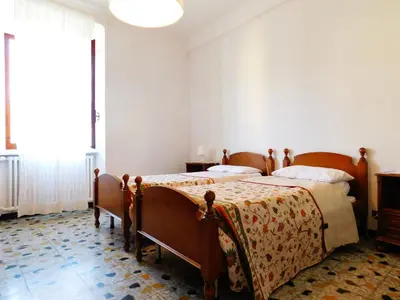 Letto o letti in una camera di Le stanze del papa, Levanto