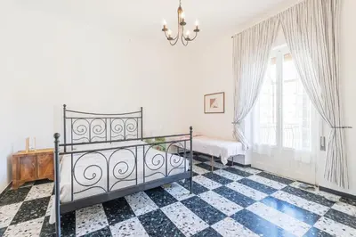 Letto o letti in una camera di Spazioso appartamento Vista Mare, Levanto