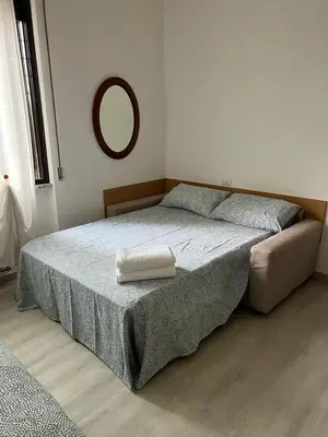 Letto o letti in una camera di Senza Pensieri via Viviani