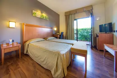 Letto o letti in una camera di Hotel Regio