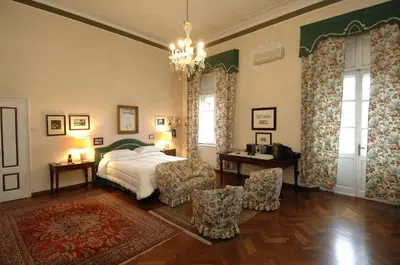 Letto o letti in una camera di Palazzo Arrivabene B&B