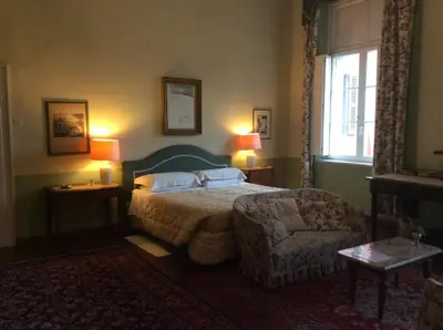 Letto o letti in una camera di Palazzo Arrivabene B&B