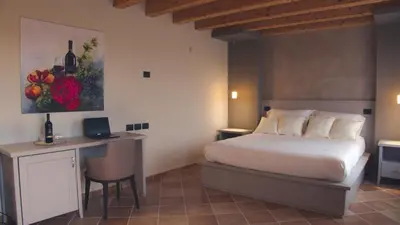 Letto o letti in una camera di Agriturismo Relais La Casina
