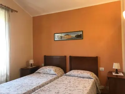 Letto o letti in una camera di Affittacamere Cerisola 2003