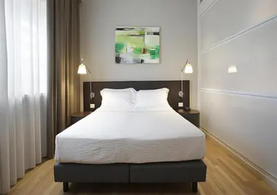 Letto o letti in una camera di Boiardo Hotel