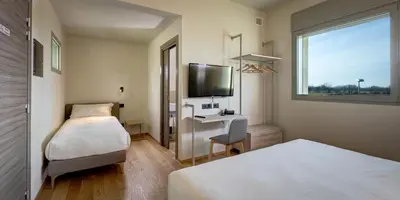 Letto o letti in una camera di Park Hotel & Residence by The Cube