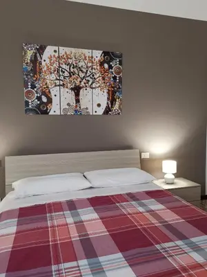 Letto o letti in una camera di AT HOME IN CREMONA