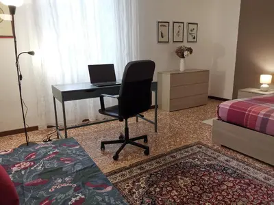 Letto o letti in una camera di AT HOME IN CREMONA