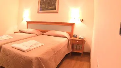 Letto o letti in una camera di Hotel Ristorante La Grotta