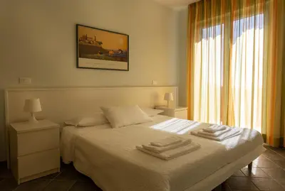 Letto o letti in una camera di Olivium