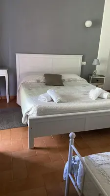 Letto o letti in una camera di La Scuderia