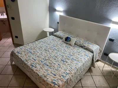 Letto o letti in una camera di B&B ALDA