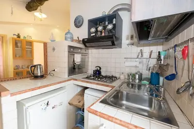 Cucina o angolo cottura di The Captains House - central quiet near beach