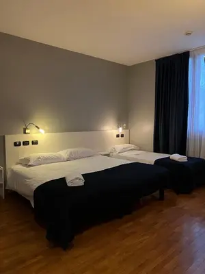 Letto o letti in una camera di Master Hotel Reggio Emilia