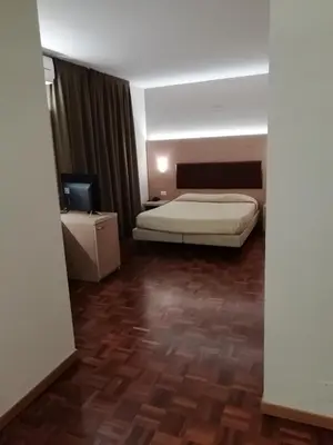 Letto o letti in una camera di HOTEL BUCA DI BACCO