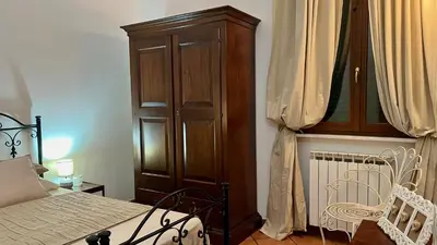 Letto o letti in una camera di CASA VACANZE MONEGLIA 2 CAMERE con TERRAZZA nel VERDE