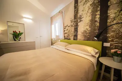 Letto o letti in una camera di Gardenhouse Sarzana