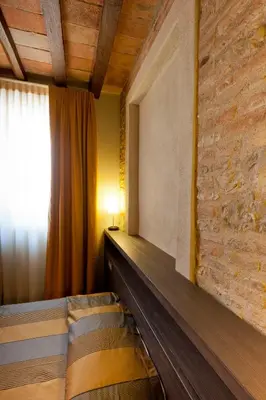Letto o letti in una camera di Locanda Sant'Ambrogio
