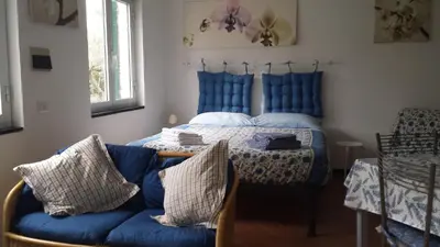 Letto o letti in una camera di Tigullio Vacations panoramica apartments