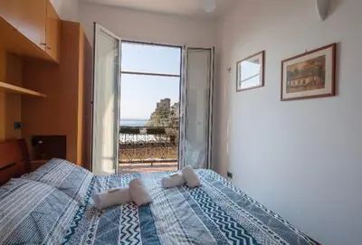 Letto o letti in una camera di Orizzonte sul mare