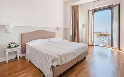 Letto o letti in una camera di Miramare Hotel