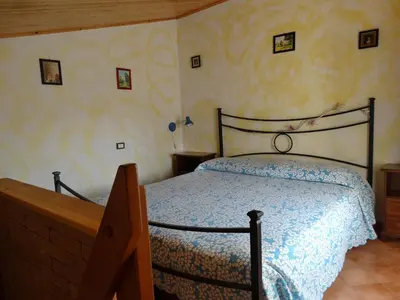 Letto o letti in una camera di Affittacamere Graziella