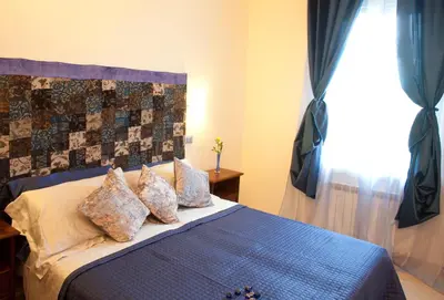 Letto o letti in una camera di B&B Al Calcandola