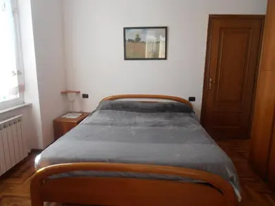 Letto o letti in una camera di Appartamento tra mare e montagna