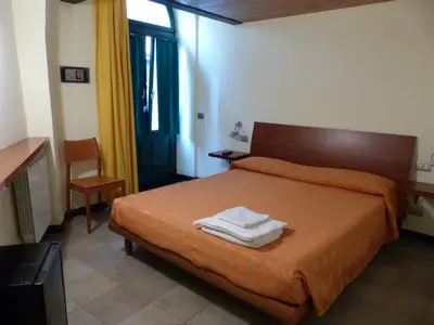 Letto o letti in una camera di Affittacamere Marco