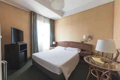 Letto o letti in una camera di Hotel Santa Maria