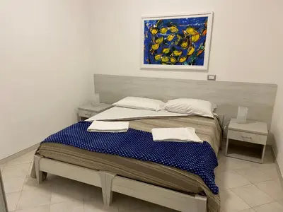 Letto o letti in una camera di MARGOT AL MARE