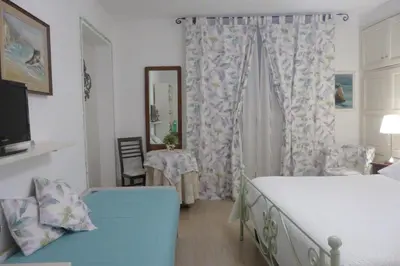 Letto o letti in una camera di Affittacamere Monica