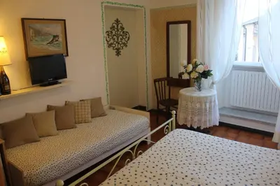 Letto o letti in una camera di Affittacamere Monica