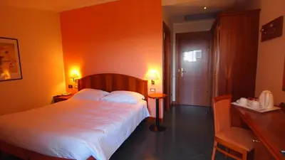 Letto o letti in una camera di Piccolo Hotel
