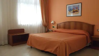 Letto o letti in una camera di Piccolo Hotel