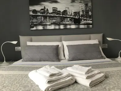 Letto o letti in una camera di La Maggiolina camere La Spezia